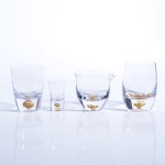 clear glass cup with golden foil bottom hole